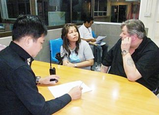 Gunnar Nordal (right) is questioned about his involvement with Kiss a-Go-Go on Soi LK Metro.